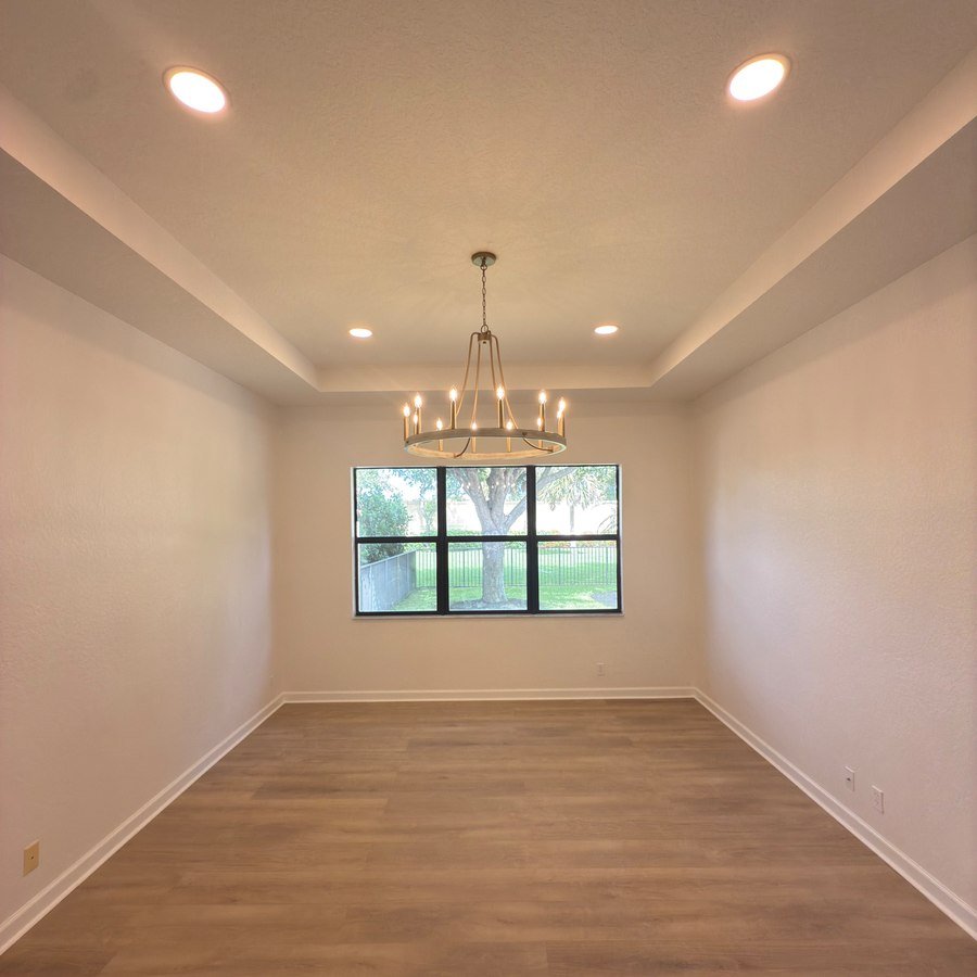 Dining room with tray ceiling and chandelier, full home renovation