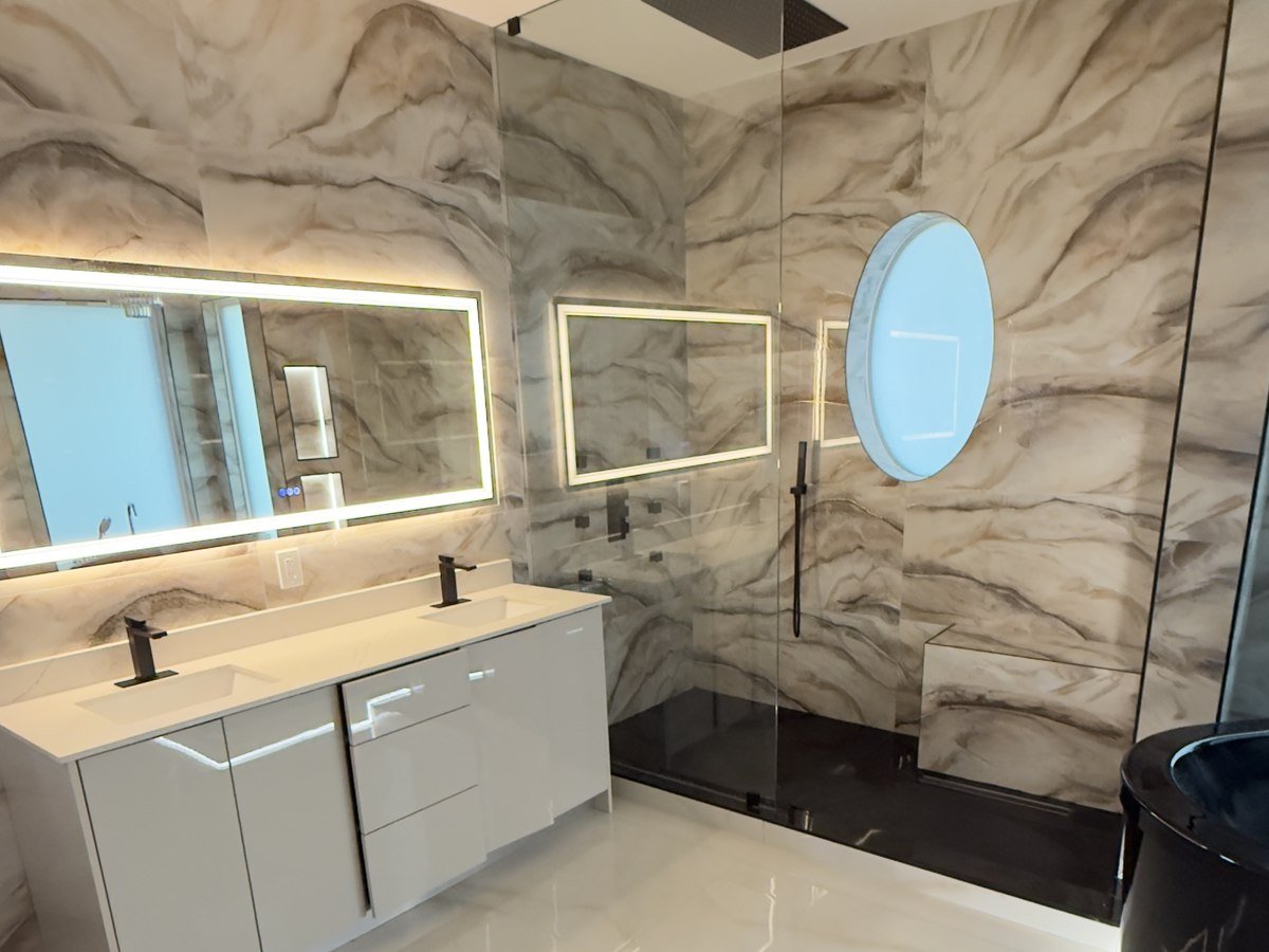 Curbless shower with round backlit window, South Florida bathroom remodel